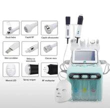 Combina cosmetică Hidroxi 9 în 1 cu capetele de lucru: duză hidro, RF, ultrasunete, skin scrubber, ciocan rece, mască LED, spray oxigen și RF multipolar